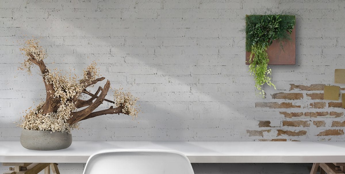 Top view of comfortable vintage workplace with office supplies and copy space on white table and brick wall