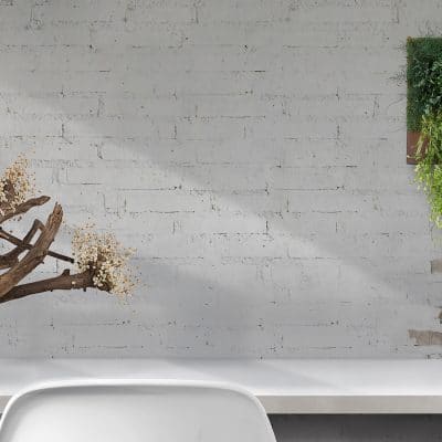 Top view of comfortable vintage workplace with office supplies and copy space on white table and brick wall