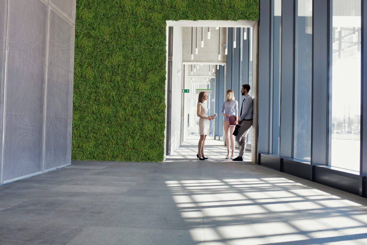 Business people talking in office corridor