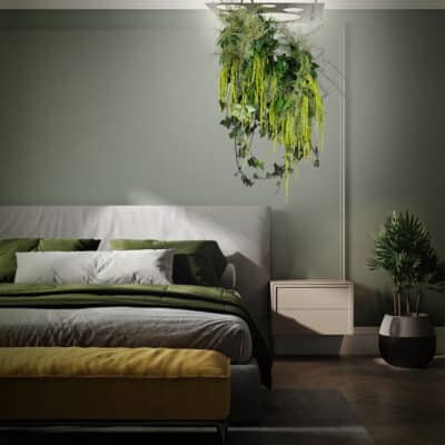 Green bedroom with gray bed on the wall in home bedroom interior