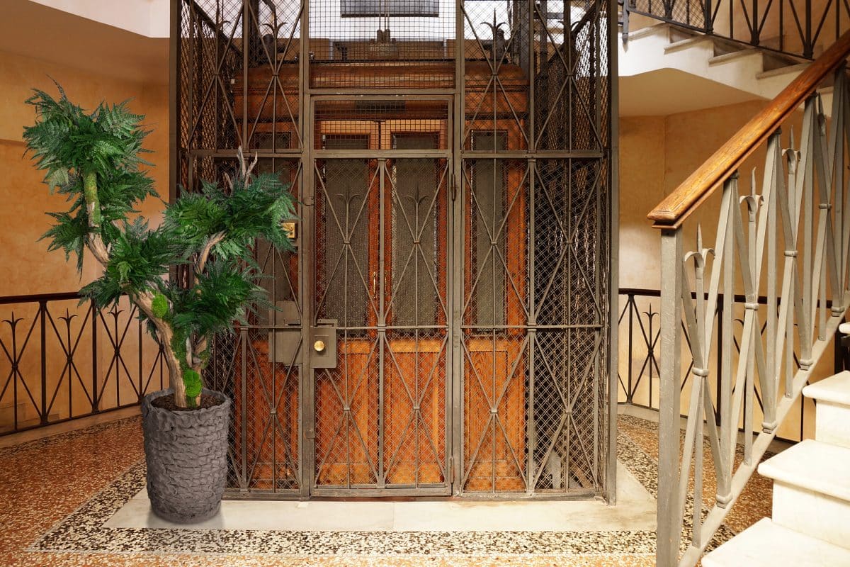 Old Wooden Elevator in a Metal Shaft