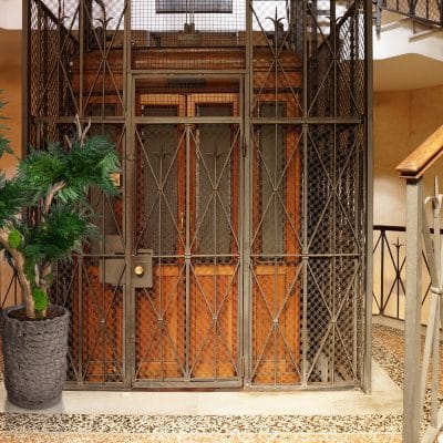 Old Wooden Elevator in a Metal Shaft